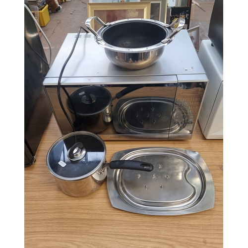 565 - Four kitchen items to include Kenwood K25MSS19 900w microwave, Cook's Essentials stainless steel lid... 