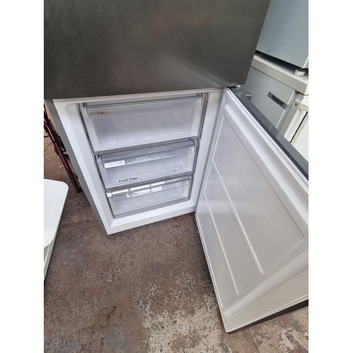 583 - A Kenwood KNF60X19 frost free upright fridge/freezer - approx. 183cm high