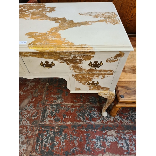 92 - A French style white and gold painted dressing table with four drawers and cabriole supports - appro... 