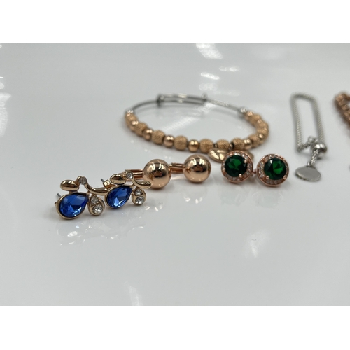 1104 - A collection of rose gold tone jewellery to include 18ct gold plated earrings, Bronze Milor Italy ne... 