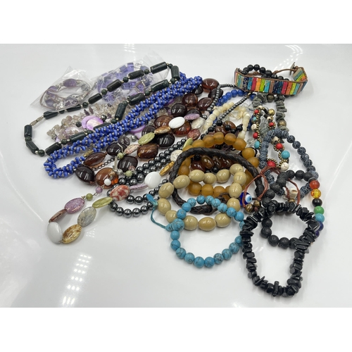 1107 - A collection of costume jewellery to include quartz and amethyst necklace, lapis lazuli bracelet etc... 