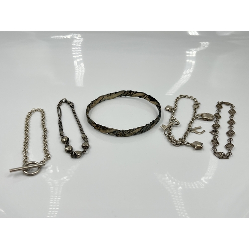 1110 - Five pieces of jewellery, four .925 silver bracelets and one Mexican white metal bangle - approx. gr... 