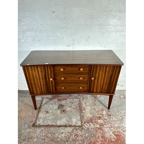 1 - A 1950s Gimson & Slater Ltd Vesper Furniture walnut sideboard with three central drawers and two out... 