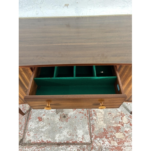 1 - A 1950s Gimson & Slater Ltd Vesper Furniture walnut sideboard with three central drawers and two out... 