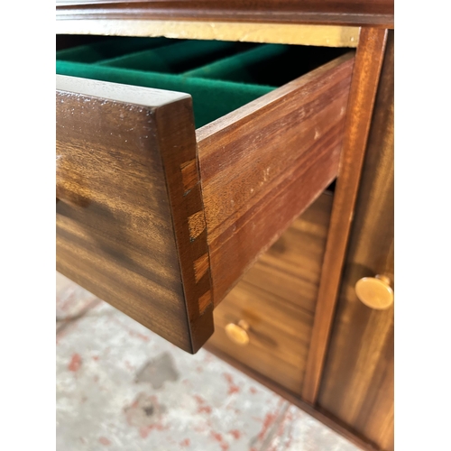 1 - A 1950s Gimson & Slater Ltd Vesper Furniture walnut sideboard with three central drawers and two out... 