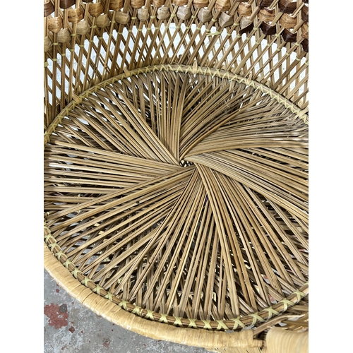 100 - A mid 20th century wicker peacock chair - approx. 108cm high x 68cm wide