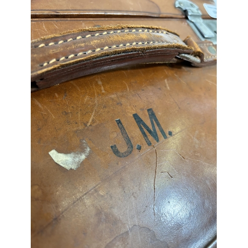 104 - A 1940s Rev-Robe brown leather suitcase retailed by Finnigans Deansgate Manchester - approx. 24cm hi... 