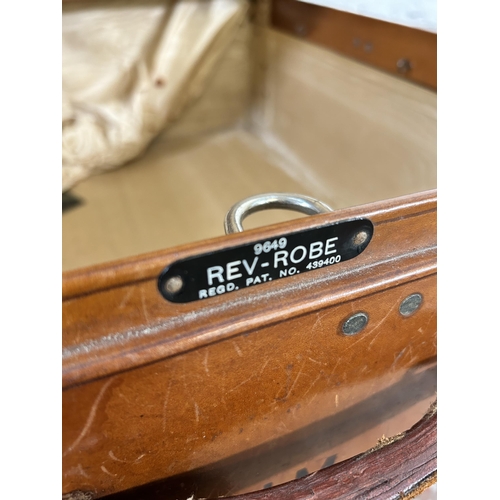 104 - A 1940s Rev-Robe brown leather suitcase retailed by Finnigans Deansgate Manchester - approx. 24cm hi... 