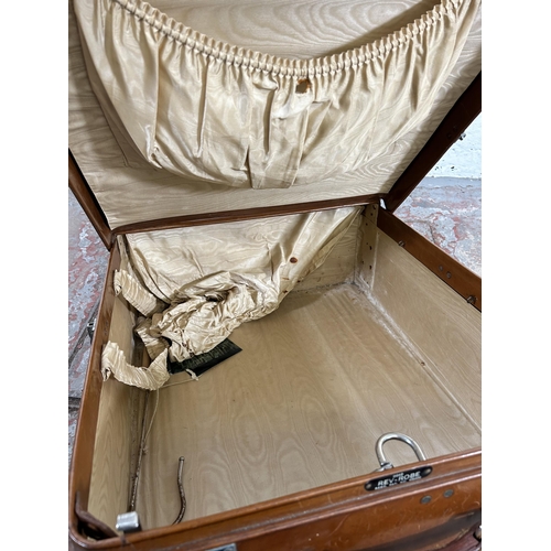 104 - A 1940s Rev-Robe brown leather suitcase retailed by Finnigans Deansgate Manchester - approx. 24cm hi... 