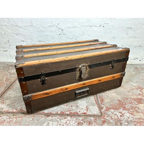 105 - An early 20th century oak banded brown canvas travel trunk with Eagle Lock Co. U.S.A. lock - approx.... 