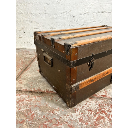 105 - An early 20th century oak banded brown canvas travel trunk with Eagle Lock Co. U.S.A. lock - approx.... 