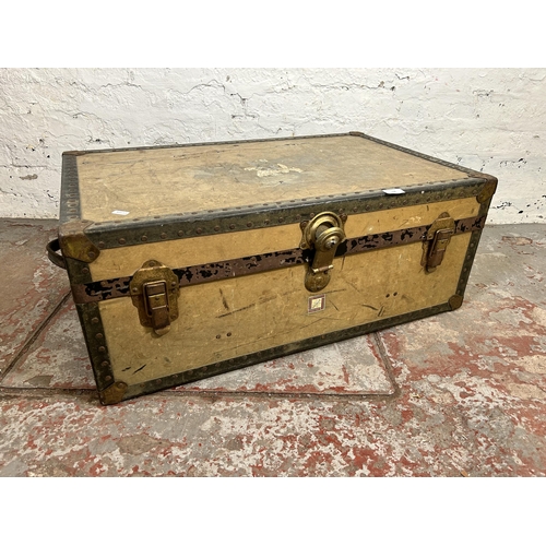 106 - An early 20th century Whatajoy London made travel trunk - approx. 33cm high x 82cm wide x 52cm deep