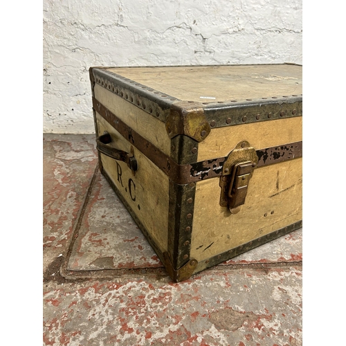 106 - An early 20th century Whatajoy London made travel trunk - approx. 33cm high x 82cm wide x 52cm deep