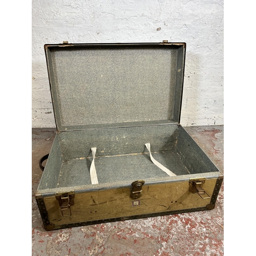 106 - An early 20th century Whatajoy London made travel trunk - approx. 33cm high x 82cm wide x 52cm deep