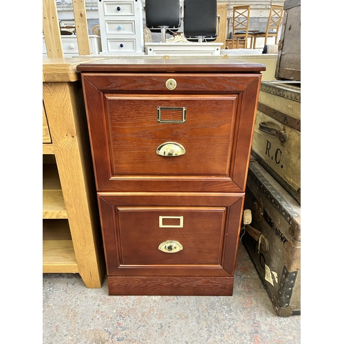 108 - An oak effect two drawer office filing cabinet with keys - approx. 77cm high x 45cm wide x 40cm deep