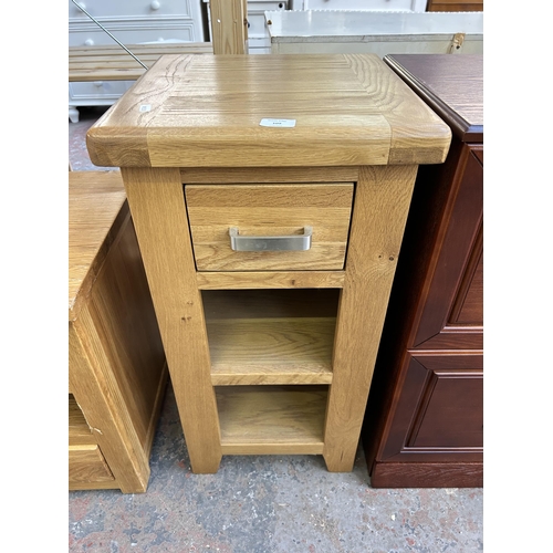 109 - A modern oak side table with single drawer and two lower shelves - approx. 77cm high x 40cm square