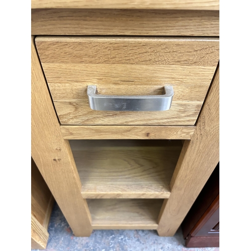 109 - A modern oak side table with single drawer and two lower shelves - approx. 77cm high x 40cm square