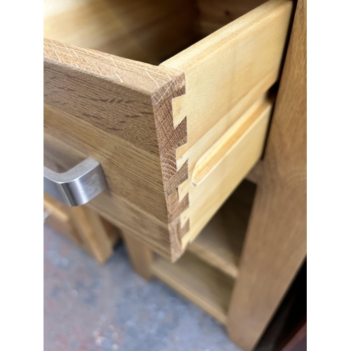 109 - A modern oak side table with single drawer and two lower shelves - approx. 77cm high x 40cm square