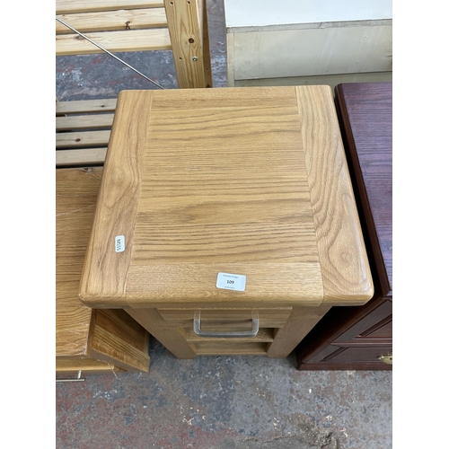 109 - A modern oak side table with single drawer and two lower shelves - approx. 77cm high x 40cm square