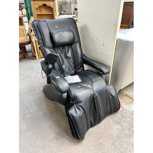 111 - An Inada W.1 black leatherette massage chair with operating manual and remote control