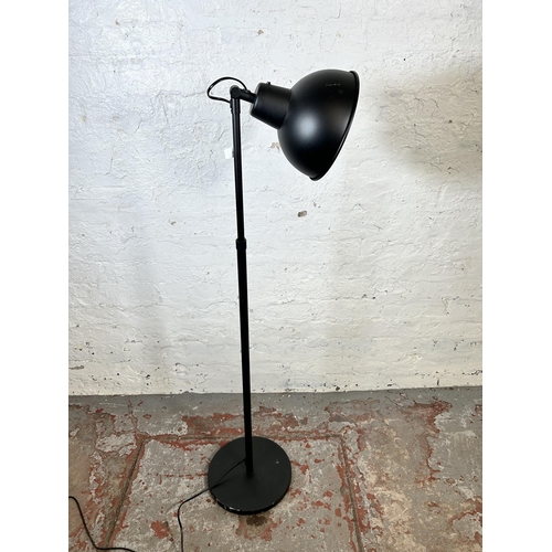 133 - An IKEA Skurup black metal floor lamp - approx. 118cm minimum height x 187cm maximum height