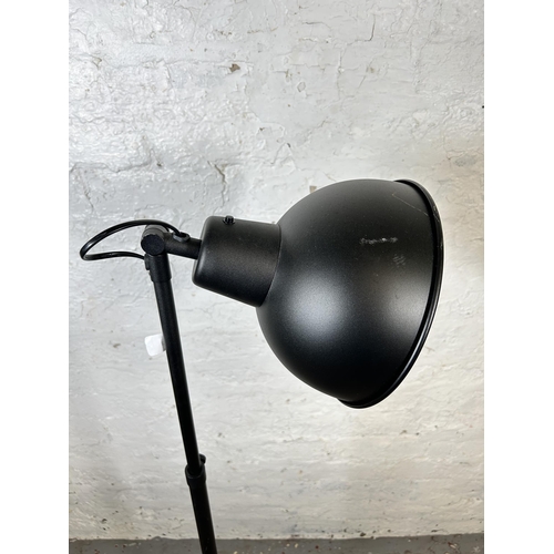 133 - An IKEA Skurup black metal floor lamp - approx. 118cm minimum height x 187cm maximum height