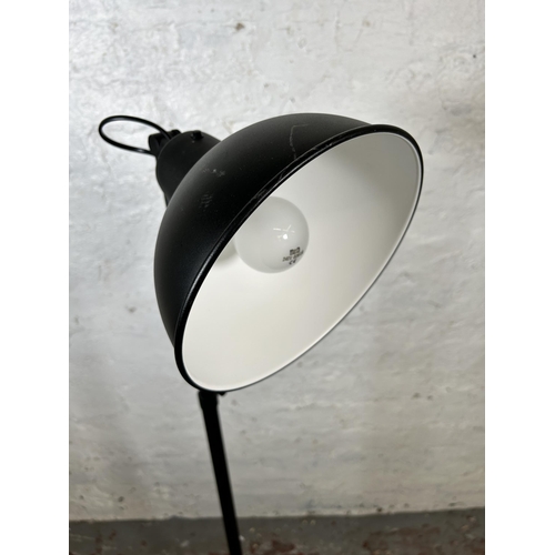 133 - An IKEA Skurup black metal floor lamp - approx. 118cm minimum height x 187cm maximum height