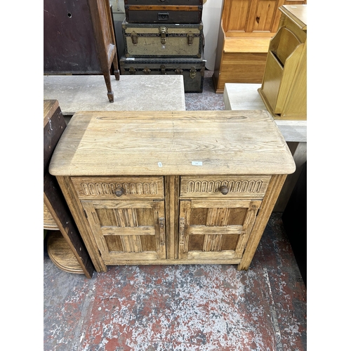 135 - Three pieces of furniture, oak sideboard, oak three tier wall hanging shelf and modern green and whi... 