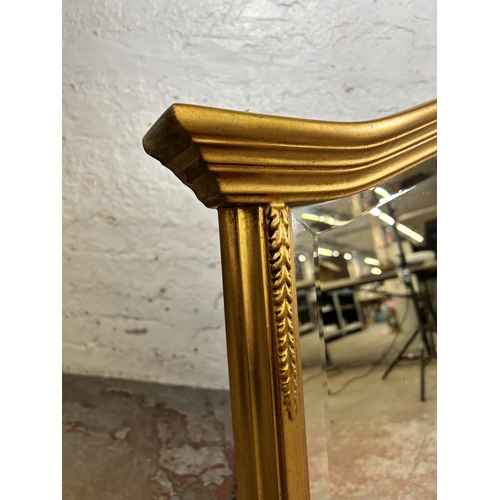 137 - A 19th century style gilt framed bevelled edge overmantel mirror - approx. 78cm high x 123cm wide