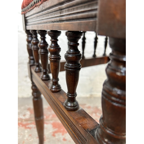 139 - An Edwardian mahogany and red floral upholstered piano stool - approx. 52cm high x 40cm wide x 33cm ... 