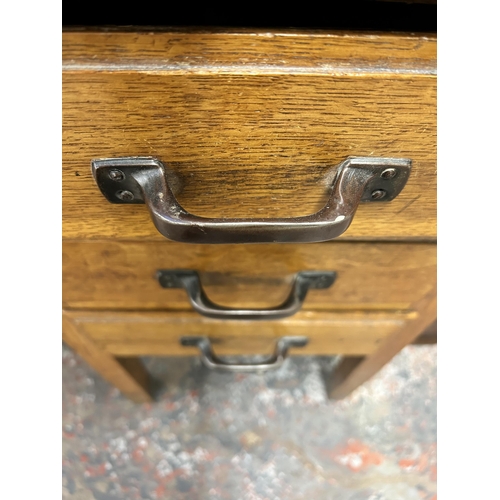 144 - A mid 20th century oak office desk with three drawers - approx. 71.5cm high x 91cm wide x 61cm deep