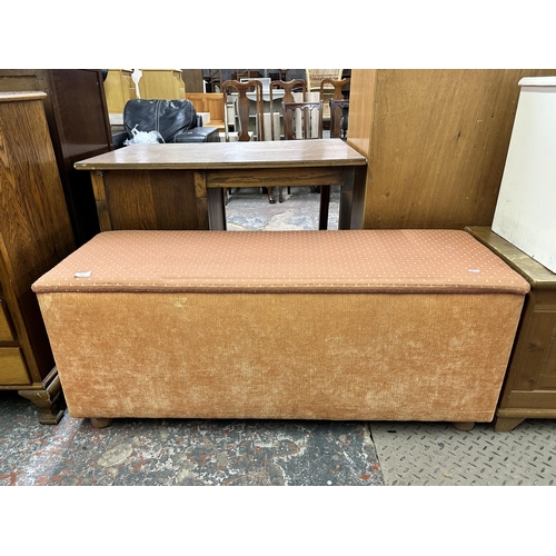 152 - A modern fabric upholstered blanket box with turned pine supports - approx. 50cm high x 120cm wide x... 