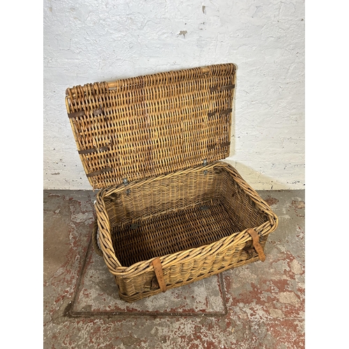 153 - A large wicker basket with two rope handles - approx. 34cm high x 80cm wide x 55cm deep