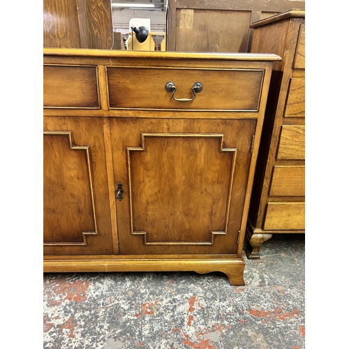 156 - A George III style yew wood sideboard with drawers and three cupboard doors - approx. 80cm high x 13... 