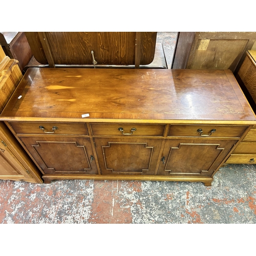 156 - A George III style yew wood sideboard with drawers and three cupboard doors - approx. 80cm high x 13... 