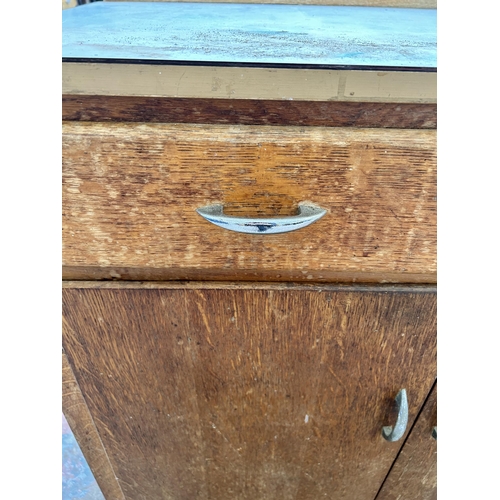 17 - A 1950s oak sideboard with white laminate top, two drawers and two lower cupboard drawers - approx. ... 