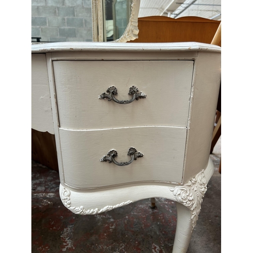 19 - A French style white painted kidney shaped dressing table with triple mirror, five drawers and cabri... 