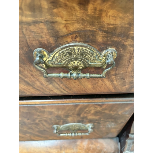 21 - A Victorian flame mahogany serpentine sideboard with six drawers and baluster supports - approx. 96c... 