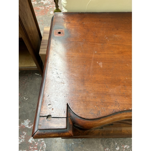 21 - A Victorian flame mahogany serpentine sideboard with six drawers and baluster supports - approx. 96c... 