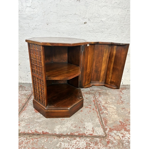 22 - A mahogany octagonal bookcase design single door cabinet - approx. 64cm high x 49cm wide x 49cm deep