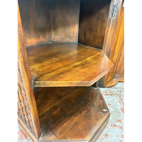 22 - A mahogany octagonal bookcase design single door cabinet - approx. 64cm high x 49cm wide x 49cm deep