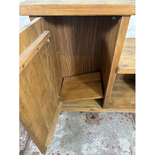 23 - An oak cabinet with single cupboard door - approx. 73cm high x 77cm wide x 37cm deep