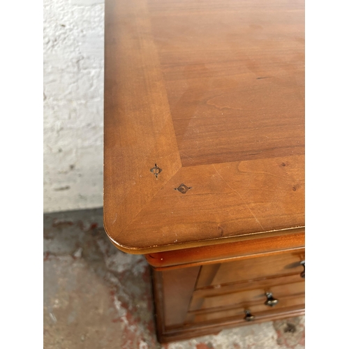 25 - An Exigence cherry wood chest of three drawers - approx. 82cm high x 114cm wide x 50cm deep