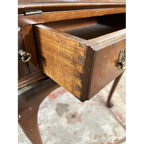 27 - A mid 20th century Queen Anne style walnut ladies bureau with single drawer, fall front and cabriole... 