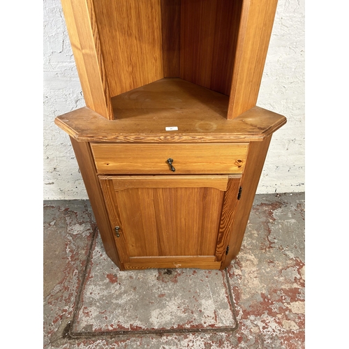 29 - A pine freestanding corner cabinet