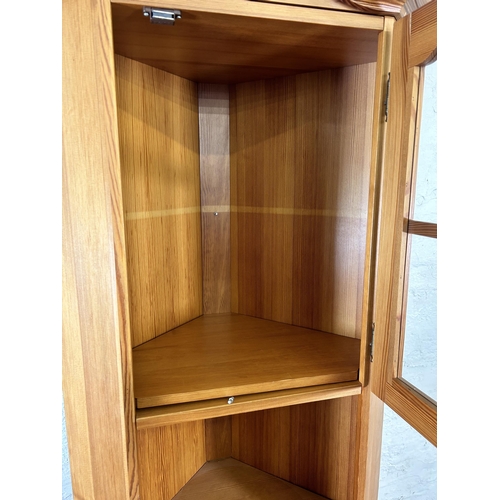 29 - A pine freestanding corner cabinet