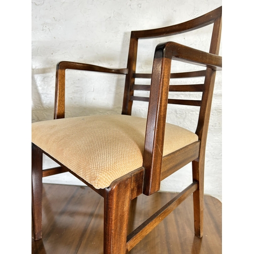 3 - A mid 20th century walnut extending dining table and six matching chairs - approx. 75cm high x 86cm ... 