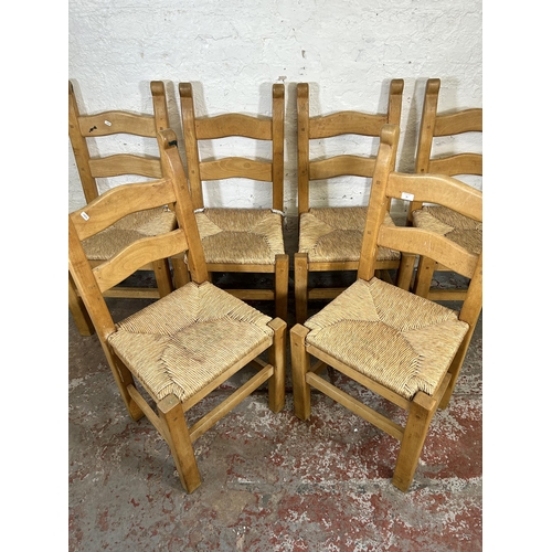 31 - A set of six beech and rush seated ladder back dining chairs - approx. 100cm high x 48cm wide x 42cm... 