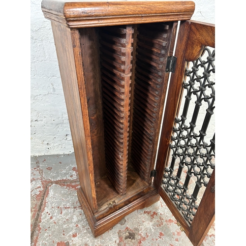 45 - An Indian sheesham wood CD rack with single door - approx. 87.5cm high x 35cm wide x 21cm deep