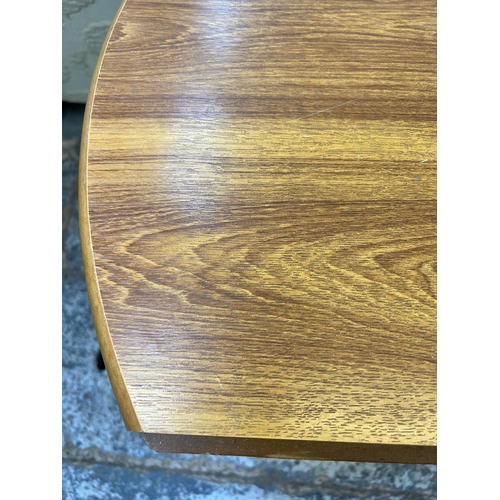 50 - A modern pine effect drop leaf circular dining table - approx. 74.5cm high x 90cm diameter